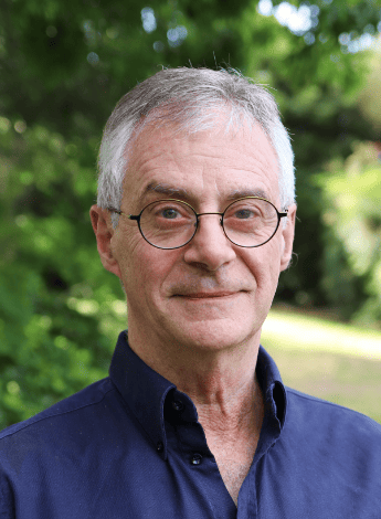 The image is of physiotherapist Guy Zito, a man with silver hair and glasses. 